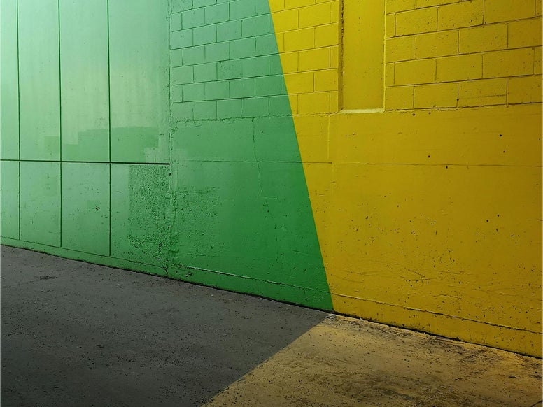 Blind wall painted in bright green and yellow. Photo by Peppered Pixels Design Studio
